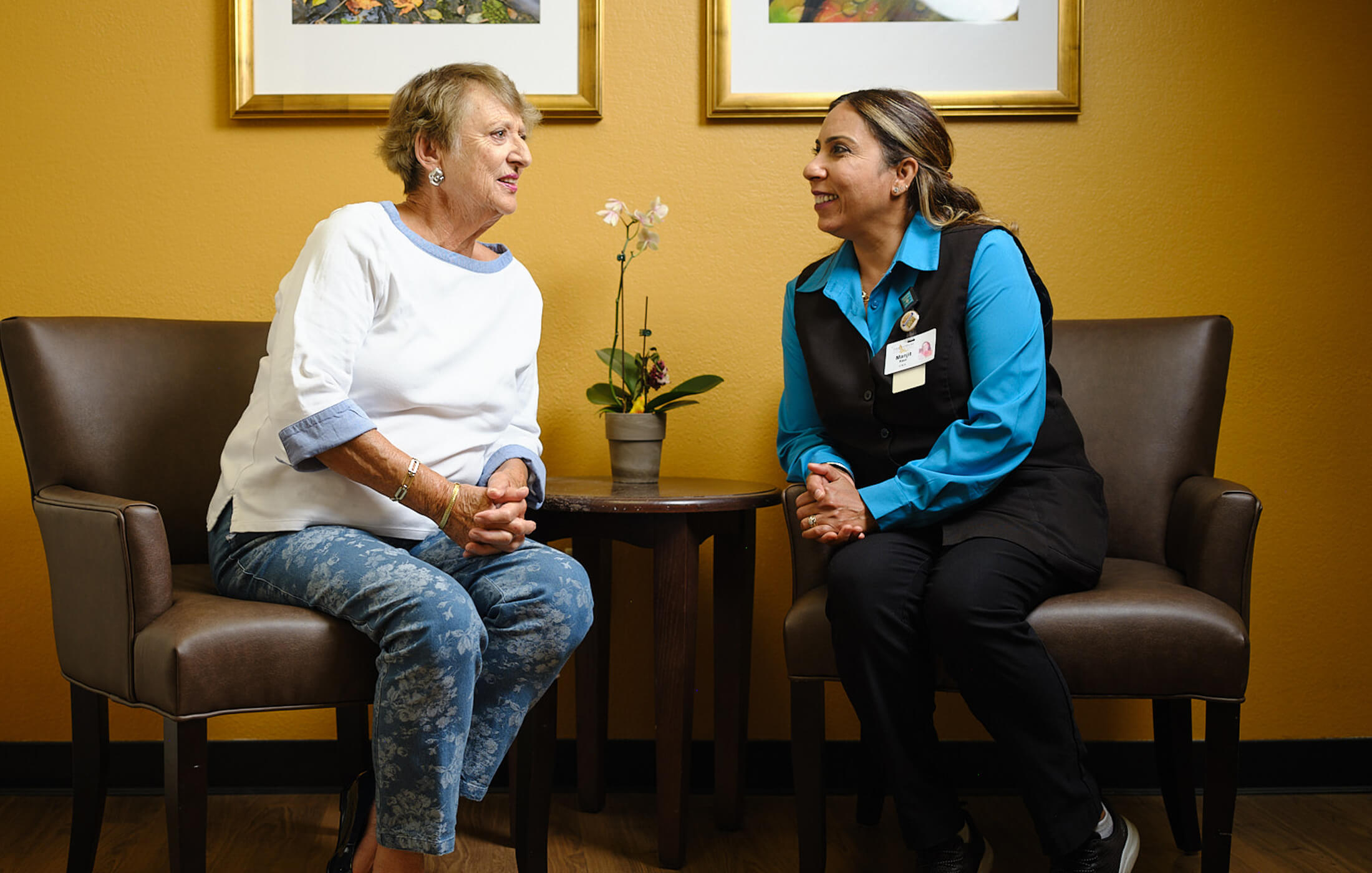 resident talking to employee