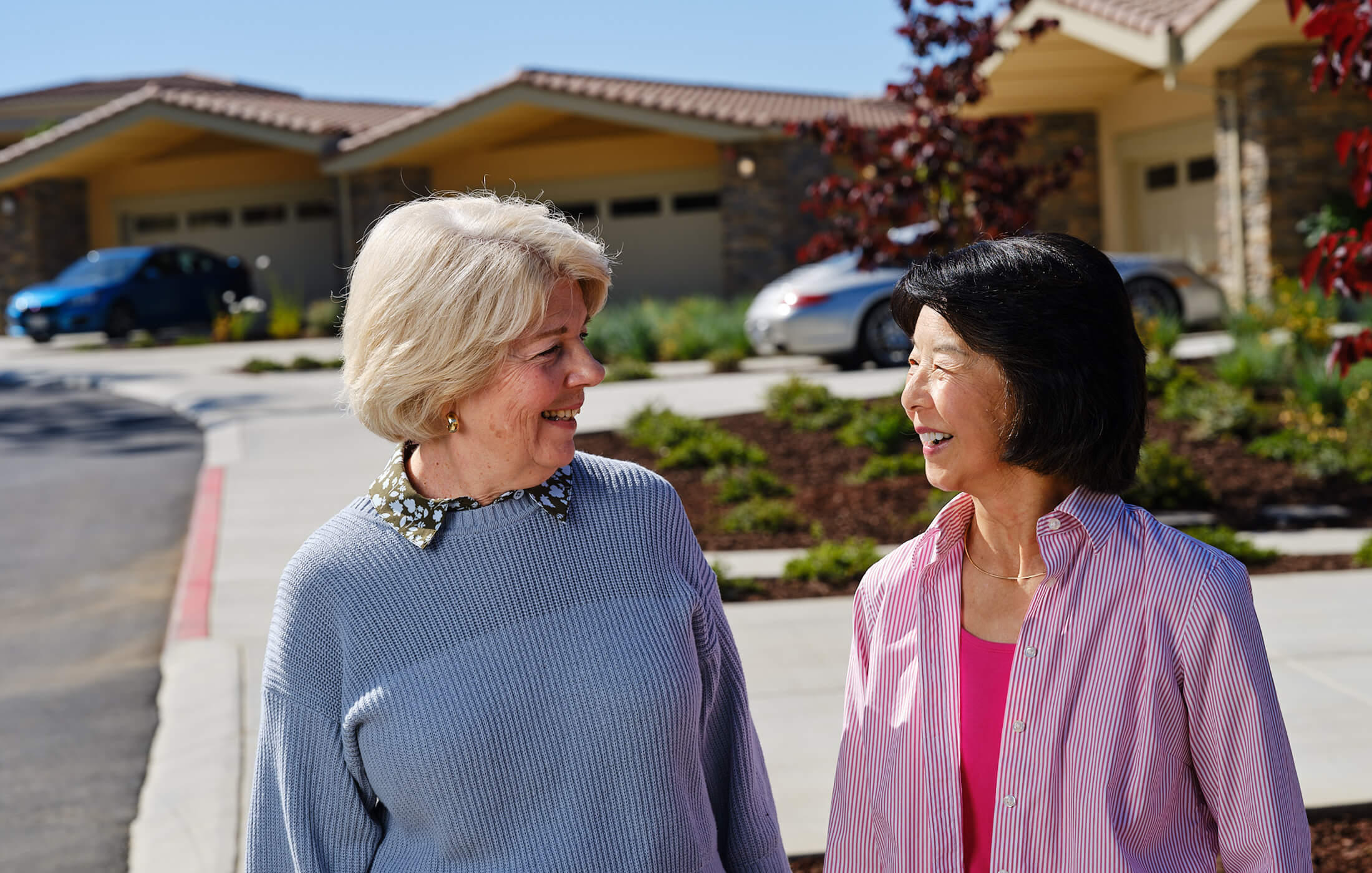 two woman smiling at each other