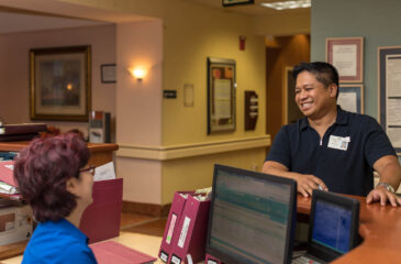 employee smiling at coworker