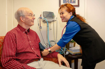 A man gets his blood pressure checked