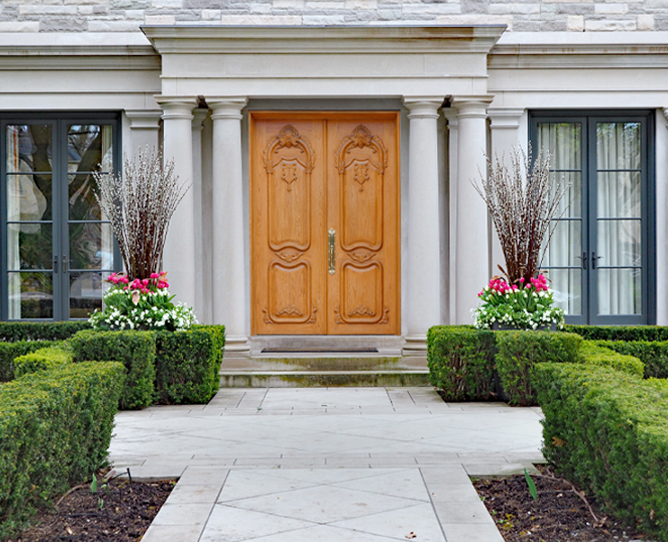 A photo of a front of a home with double doors