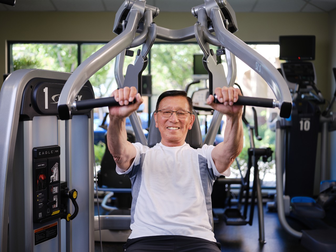 A senior man working out in a gym